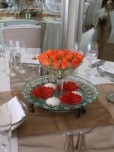 Guest table centrepiece, cone vase, roses, Gerberas and floating candles - Twelve Apostles Hotel, Cape peninsula